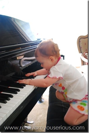 baby plays piano