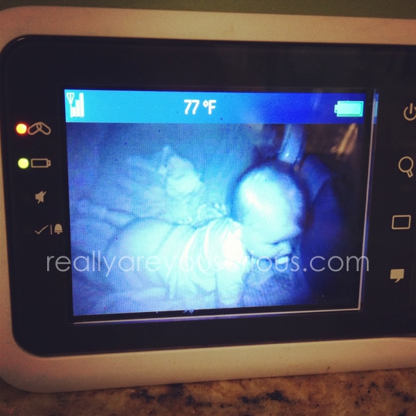 on all fours in a crib