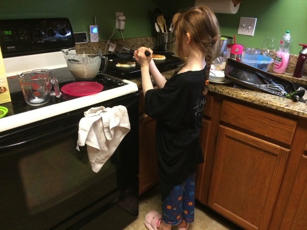 cooking herself breakfast