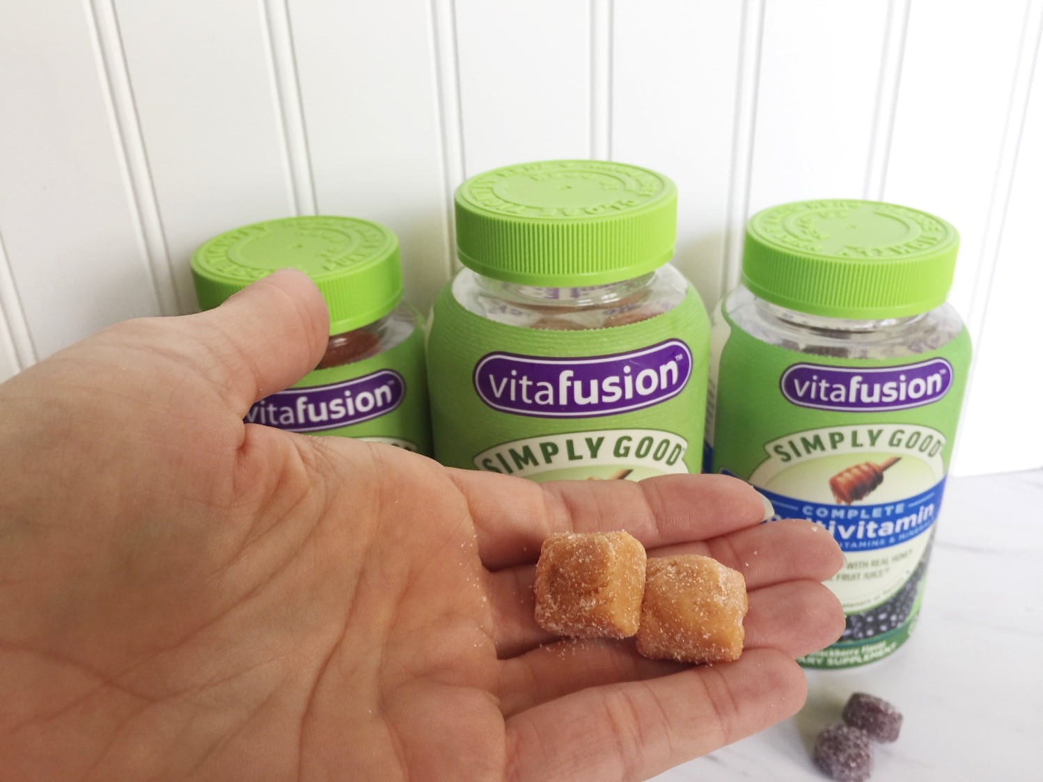 Vitafusion vitamins in hand