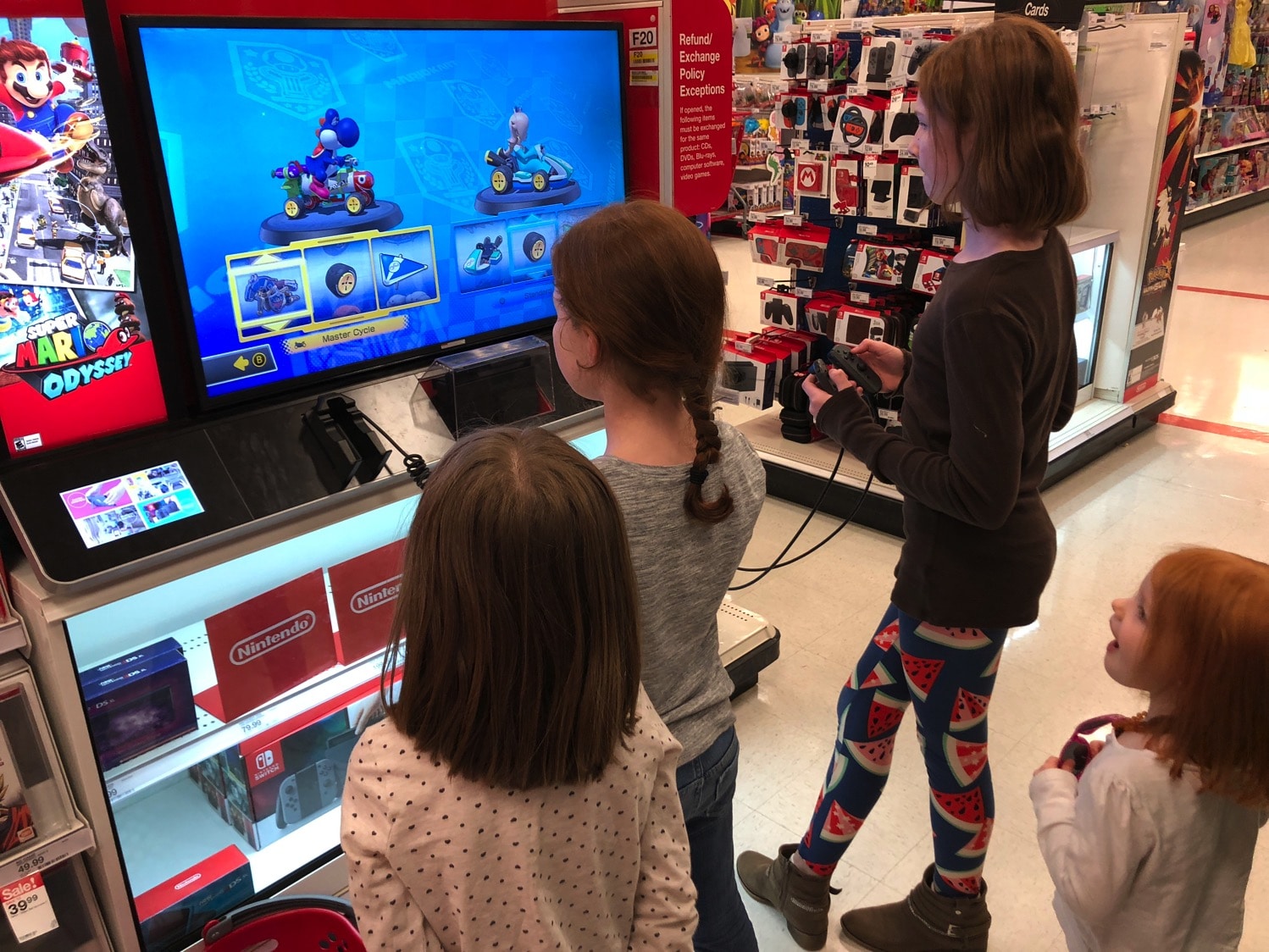 girls playing nintendo switch at target