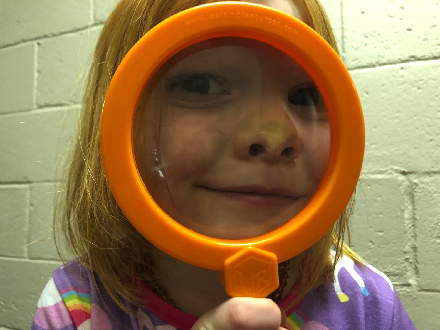 playing with magnifying glasses