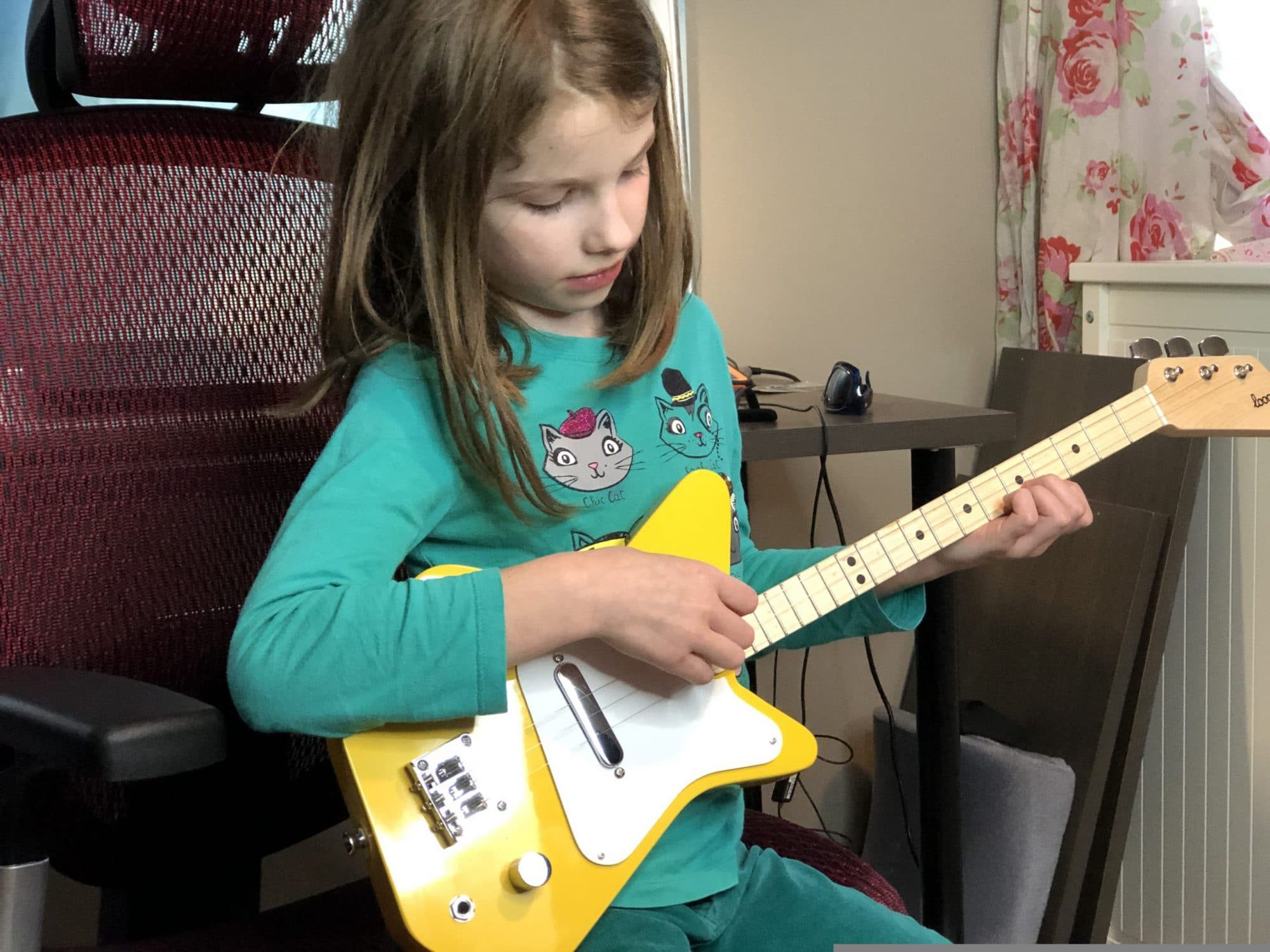 Loog guitar with kid for learning guitar
