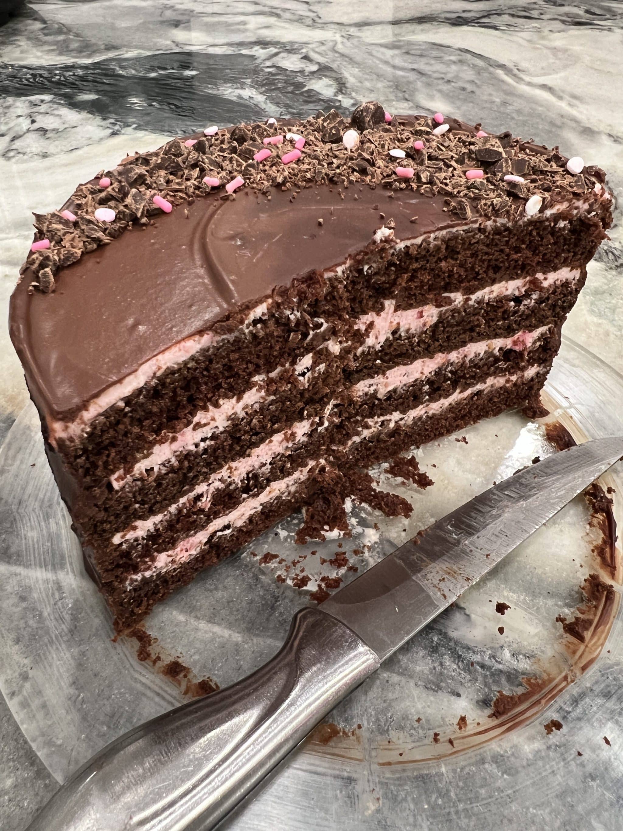 birthday cake: chocolate cake layers with whipped raspberry filling topped with chocolate ganache and chocolate shavings