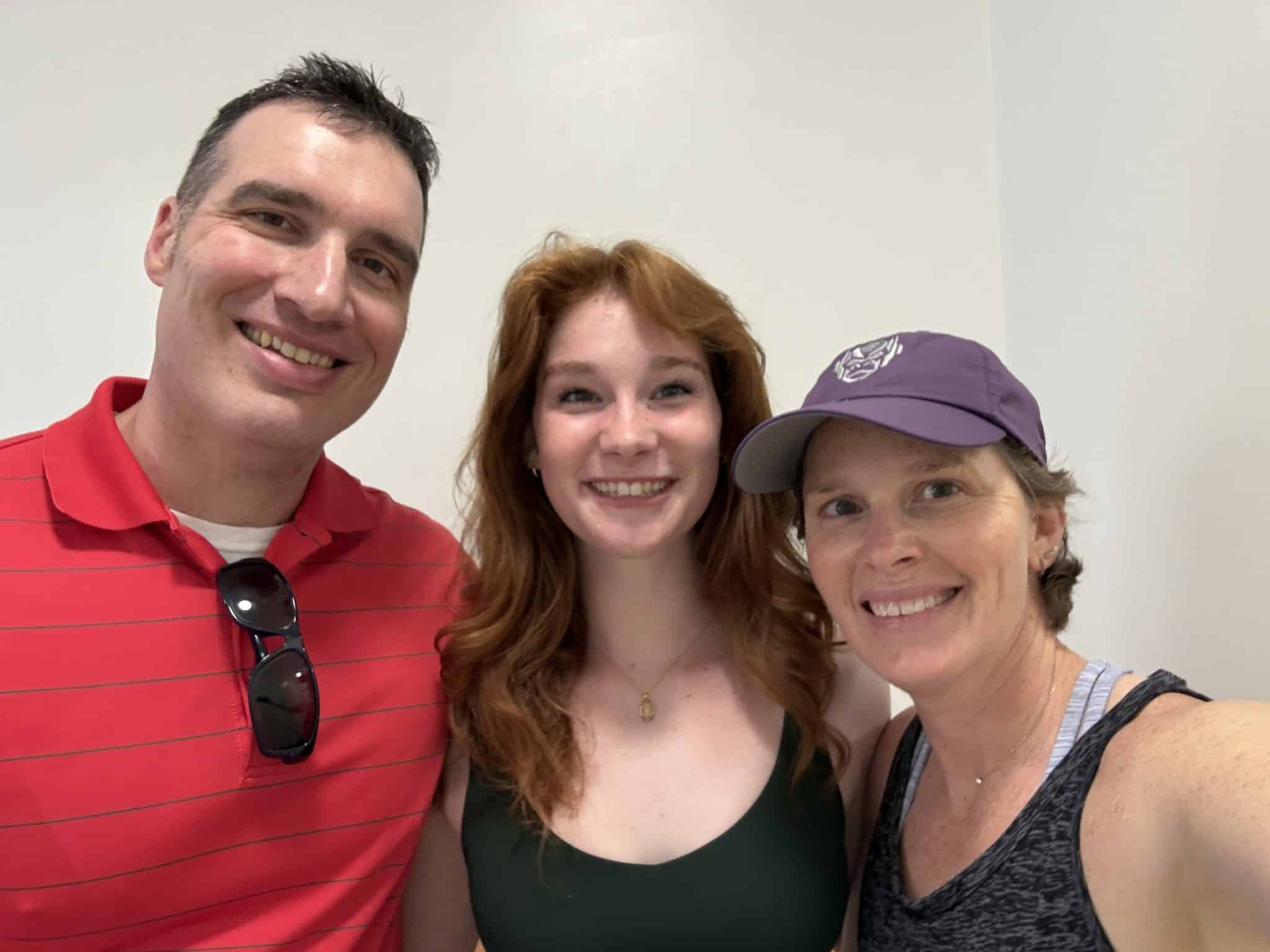 mom, daughter and father on college move out day